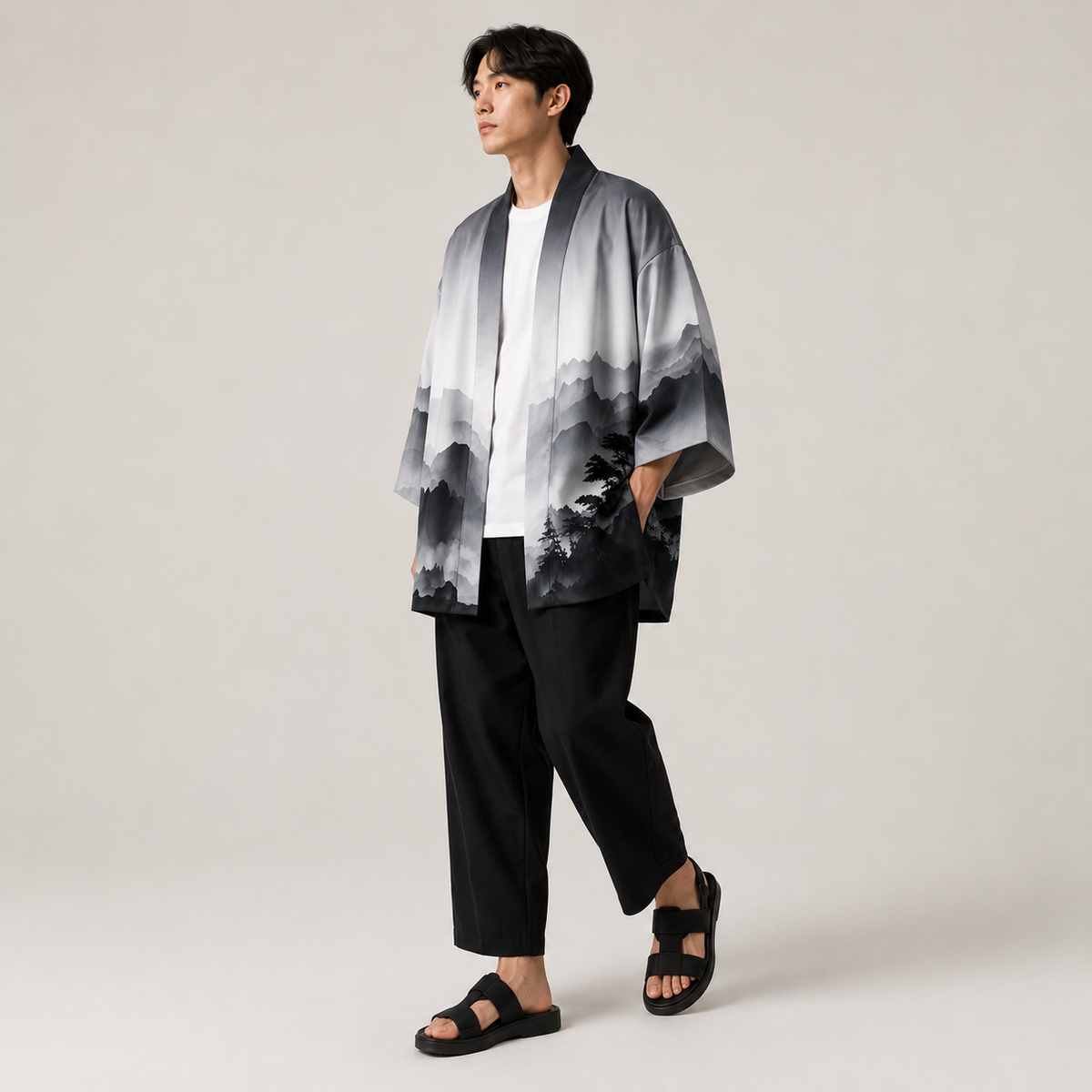 Homme portant un kimono japonais gris à imprimé paysage avec coupe ample pour un style moderne et raffiné